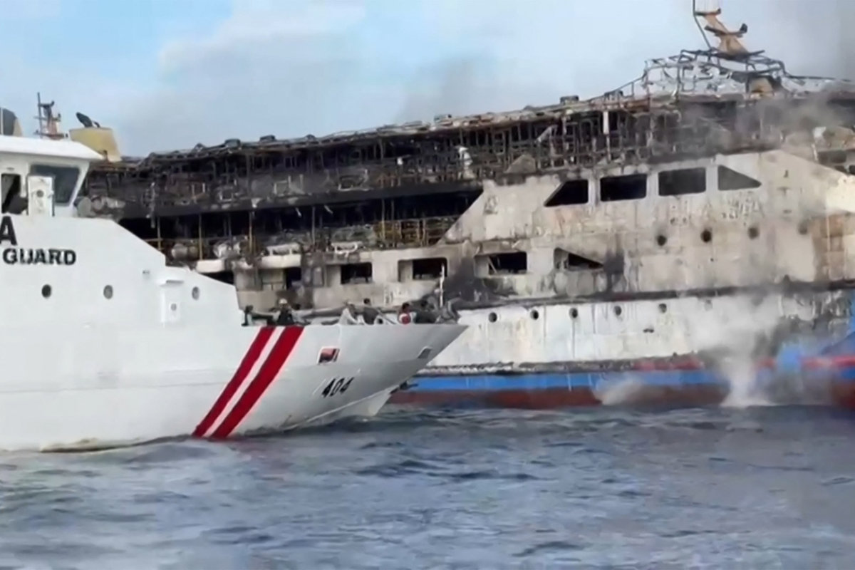 This screen grab taken from video released by Indonesia's National Search and Rescue Agency (BASARNAS) and the Indonesian Coast Guard shows the KM Barcelona 5 ferry after a fire broke out while on its way to Manado, the capital of North Sulawesi province. - AFP PHOTO / Indonesia's National Search and Rescue Agency (BASARNAS) / Indonesian Coast Guard