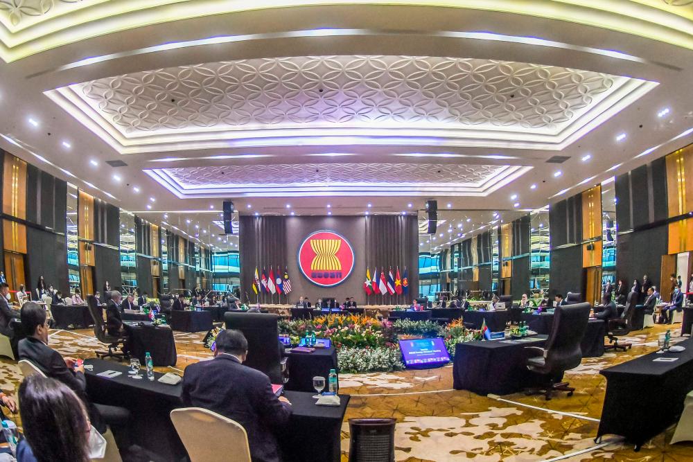 This handout picture taken and released on October 27, 2022 by the Indonesian ministry of foreign affairs shows the foreign ministers of the Association of Southeast Asia Nations (ASEAN) countries attending the Special ASEAN Foreign Ministers’ Meeting (SAFMM) at ASEAN secretariat general building, in Jakarta. AFPPIX