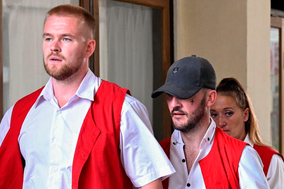 British nationals (L-R) Phineas Ambrose Float, Jonathan Christopher Collyer and Lisa Ellen Stocker are brought to court for their trial in Denpasar, Indonesia’s Bali island on June 24, 2025. (Photo by SONNY TUMBELAKA / AFP)
