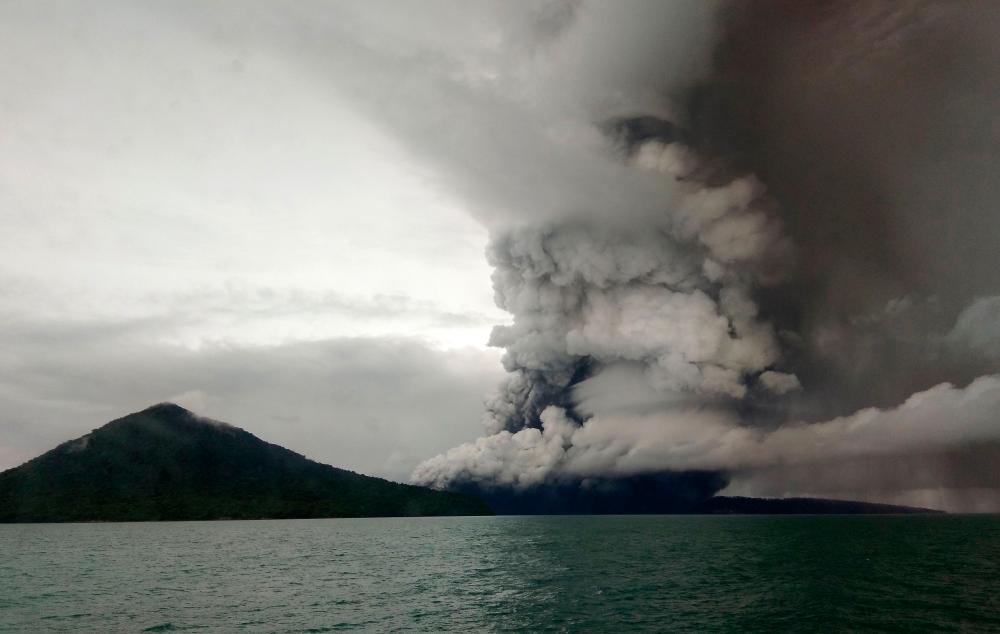 This picture taken on December 26, 2018 shows the Anak Krakatoa volcano erupting, as seen from a ship on the Sunda Straits. FILEPIX/AFPPIX