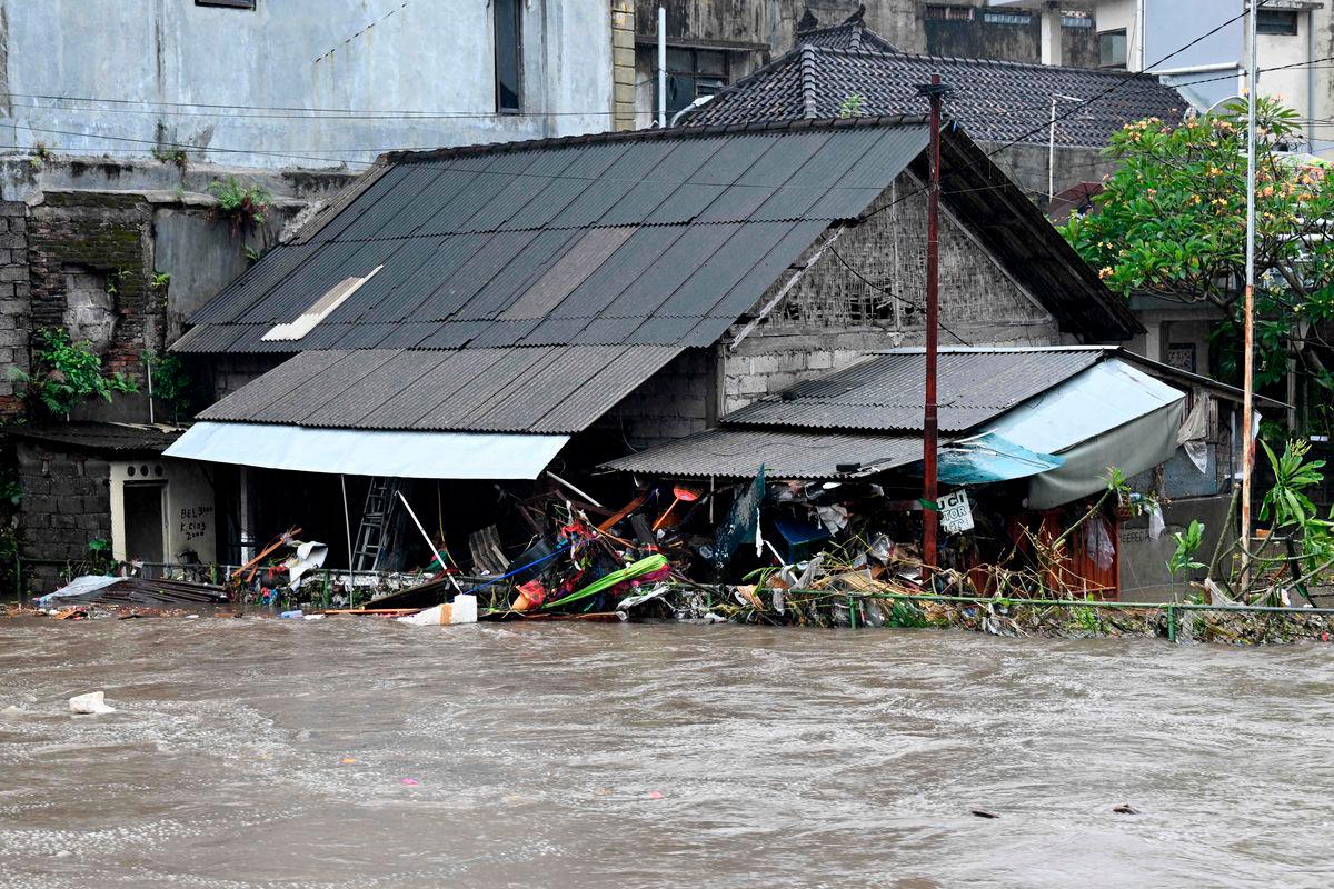 A house is inundated by floodwaters following heavy rain in Denpasar, Indonesia’s Bali island, on September 10, 2025. (Photo by SONNY TUMBELAKA / AFP)
