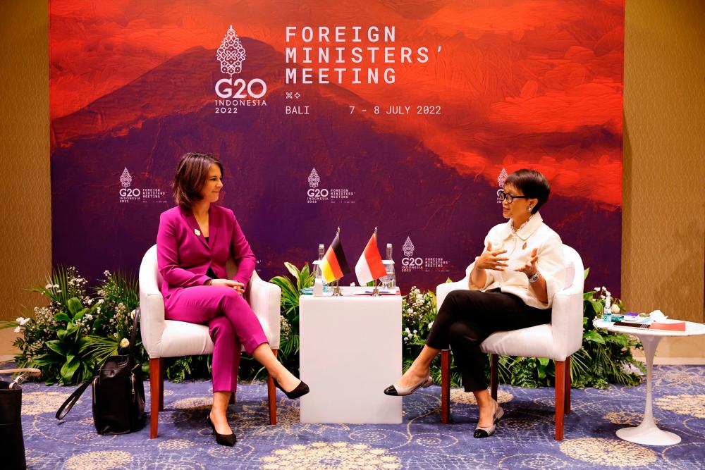 Indonesia’s Foreign Minister Retno Marsudi (R) and Germany’s Foreign Minister Annalena Baerbock (L) attend a bilateral meeting during the G20 Foreign Ministers’ Meeting in Nusa Dua on the Indonesian resort island of Bali on July 8, 2022. AFPPIX