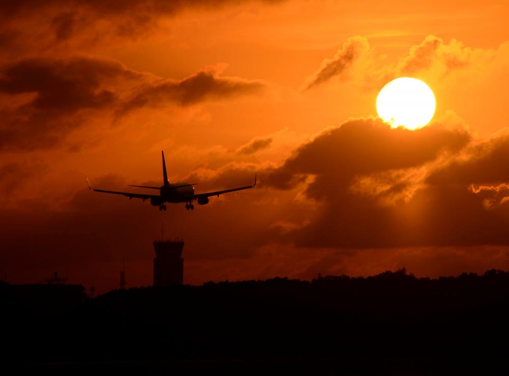 A plane prepares to land at Ngurah Rai international airport during sunset in Denpasar, on Indonesia’s resort island of Bali on October 23, 2021. AFPpix