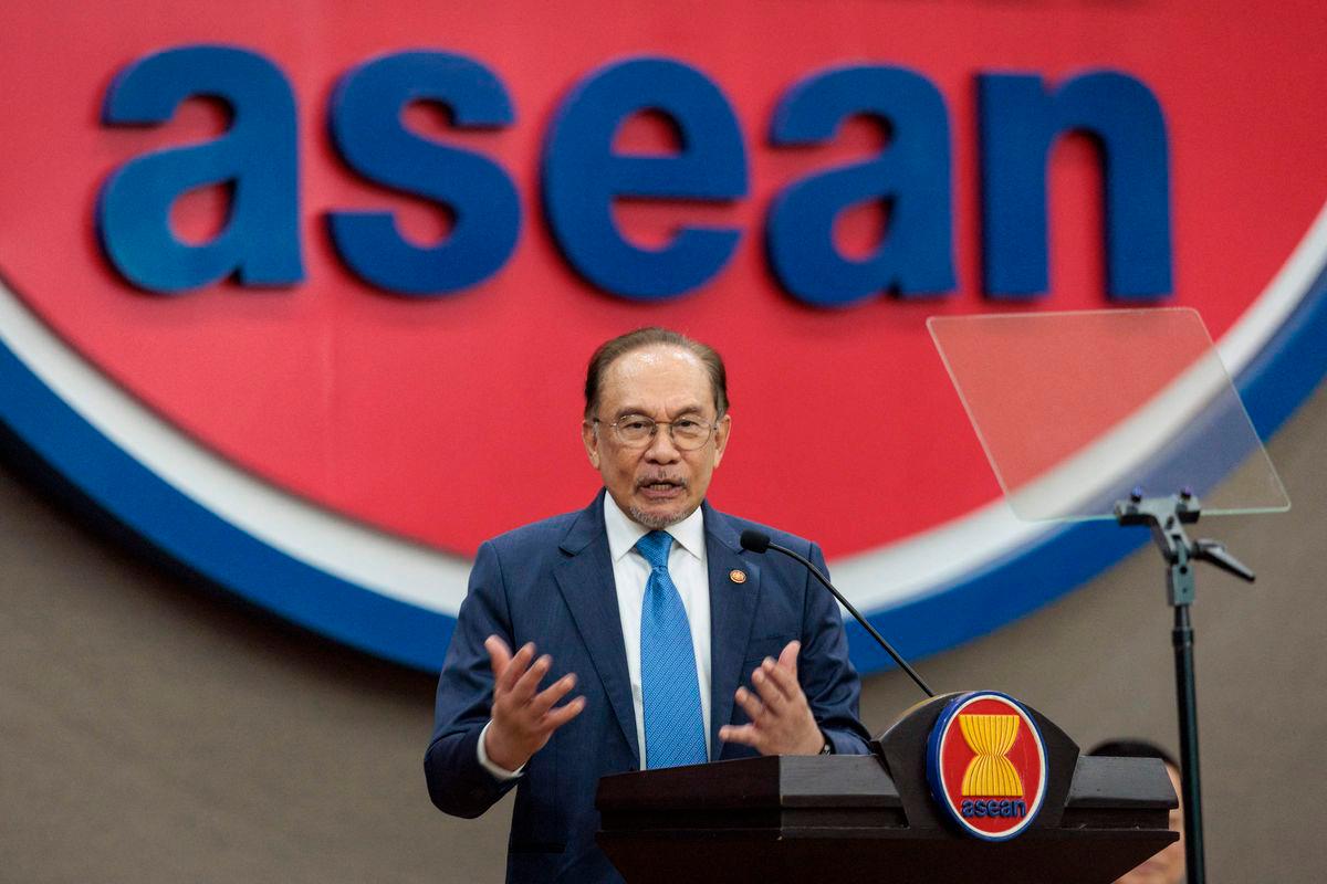 Prime Minister Anwar Ibrahim delivers a speech at the Association of Southeast Asian Nations (ASEAN) Secretariat in Jakarta on July 29, 2025. (Photo by YASUYOSHI CHIBA / AFP)