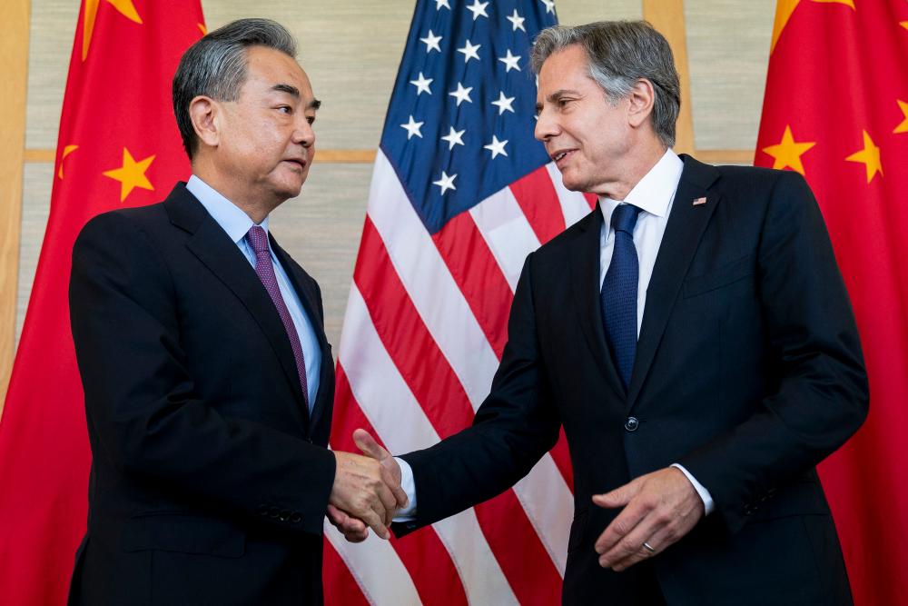 US Secretary of State Antony Blinken (R) shakes hands with China’s Foreign Minister Wang Yi during a meeting in Nusa Dua on the Indonesian resort island of Bali on July 9, 2022. AFPPIX