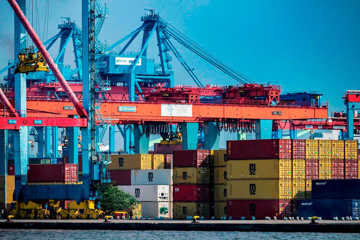 Stacks of cargo containers are kept at the Jakarta International Container Terminal in Tanjung Priok Port, Jakarta on July 7, 2025. - Bay ISMOYO / AFP