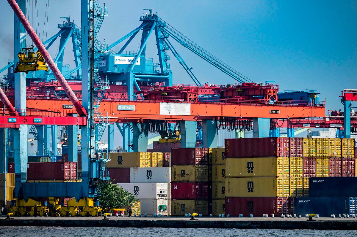 Stacks of cargo containers are kept at the Jakarta International Container Terminal in Tanjung Priok Port, Jakarta on July 7, 2025. - Bay ISMOYO / AFP