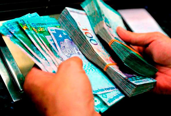 Bank Negara Malaysia’s efforts to upgrade financial infrastructure and promote digital payment connectivity have improved the ringgit’s accessibility and efficiency in international systems. – AFP filepic