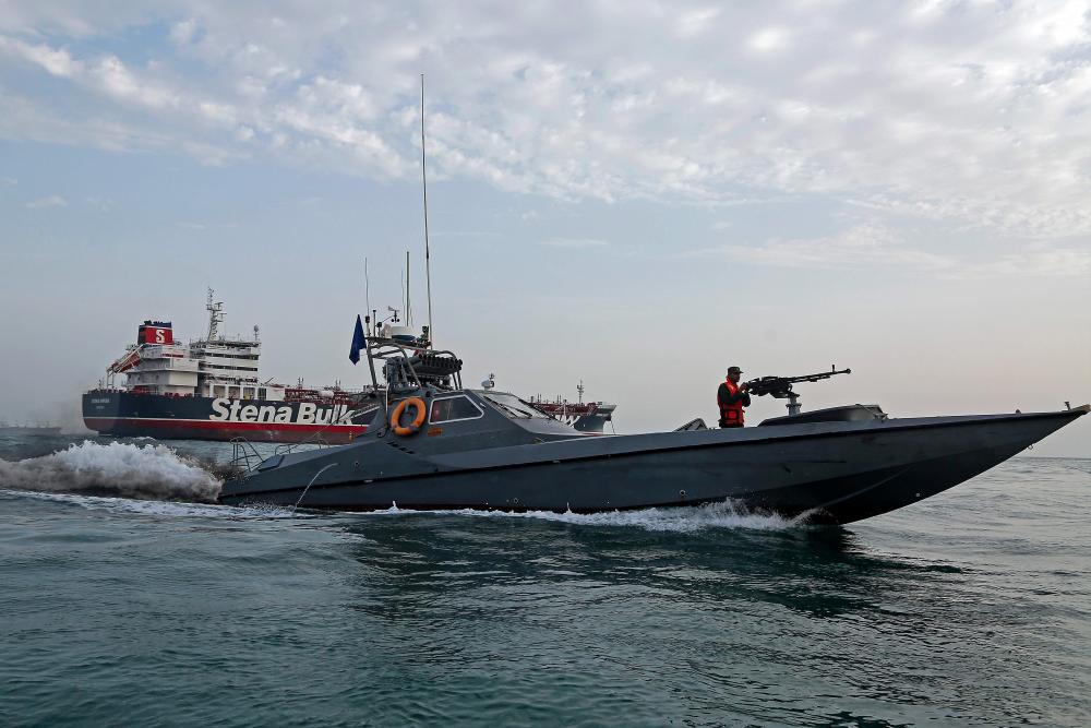 A picture taken on July 21, 2019, shows Iranian Revolutionary Guards patrolling around the British-flagged tanker Stena Impero as it’s anchored off the Iranian port city of Bandar Abbas. — AFP