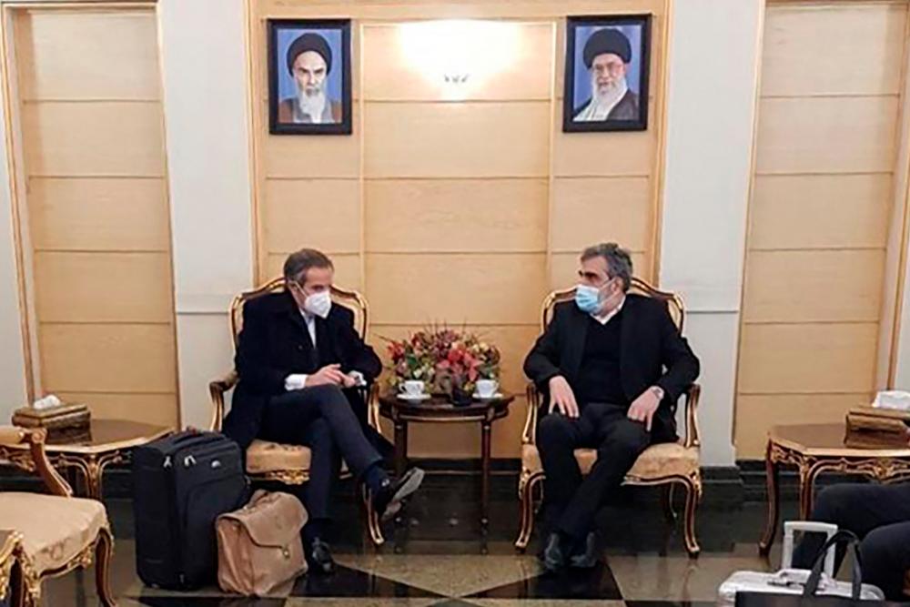 March 4, 2022 shows AEOI spokesman Behrouz Kamalvandi (R) meeting with the head of the International Atomic Energy Agency (IAEA) Rafael Grossi upon his arrival in the capital Tehran. AFPPIX