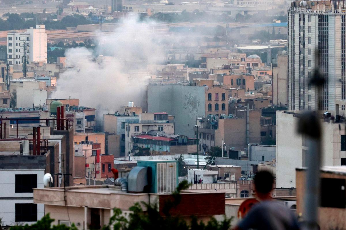 Smoke billows from an explosion in southwest Tehran on June 16, 2025. (Photo by ATTA KENARE / AFP)