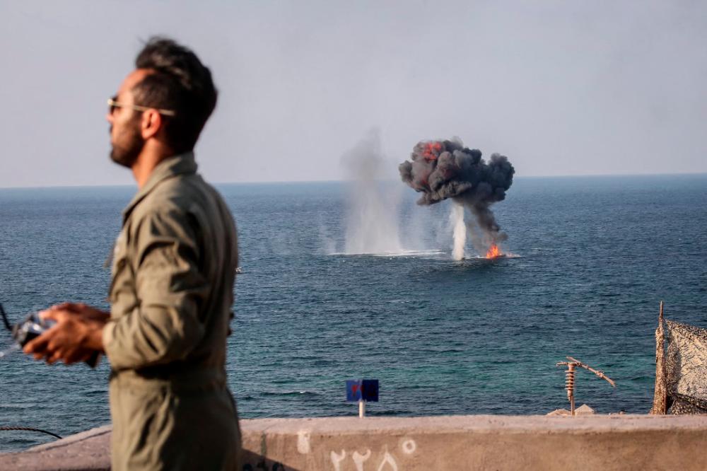 This handout photo provided by Iran's Revolutionary Guard Corps (IRGC) official website via SEPAH News on December 22, 2021, shows the Islamic Revolutionary Guard Corps (IRGC) taking part in five-days military exercises in three provinces. The military manouevres come after the United States said it was preparing alternatives in case negotiations to revive a deal to curb Iran's nuclear programme collapse in Vienna. AFPPIX