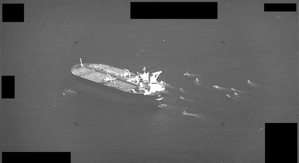 This US Navy handout screenshot of a video shows fast-attack craft from Iran’s Islamic Revolutionary Guard Corps Navy swarming Panama-flagged oil tanker Niovi as it transits the Strait of Hormuz on May 3, 2023. AFPPIX