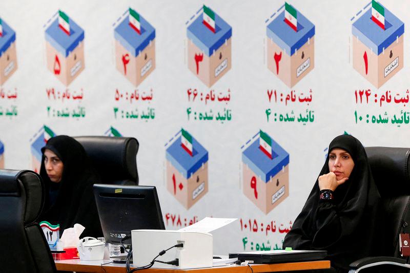 Iranian electoral officials sit at a candidates' registration office, in Tehran on May 30, 2024, ahead of the country's presidential election. - AFPPIX