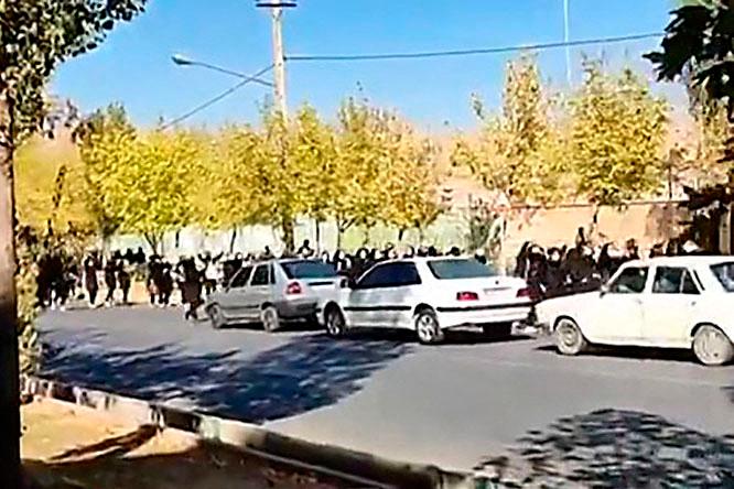 This grab taken from a UGC video made available on the ESN platform on October 4, 2022 shows school students cheering and chanting as they venture out onto the streets of Saqqez city in Iran’s Kurdistan province, hometown of Mahsa Amini. AFPPIX