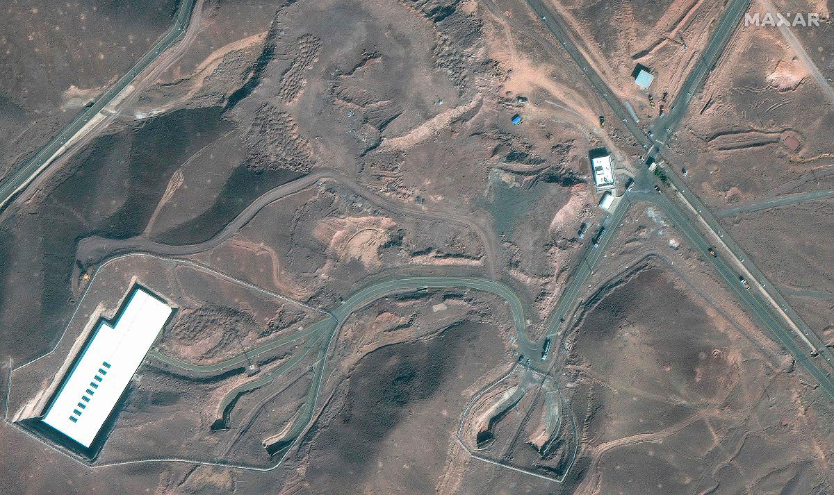 This handout satellite image courtesy of Maxar Technologies shows cargo trucks postioned near an underground entrance to Iran’s Fordow Fuel Enrichment Plant (FFEP), in Fordo, Iran on June 20, 2025. - AFP PHOTO / Satellite image ©2025 Maxar Technologies