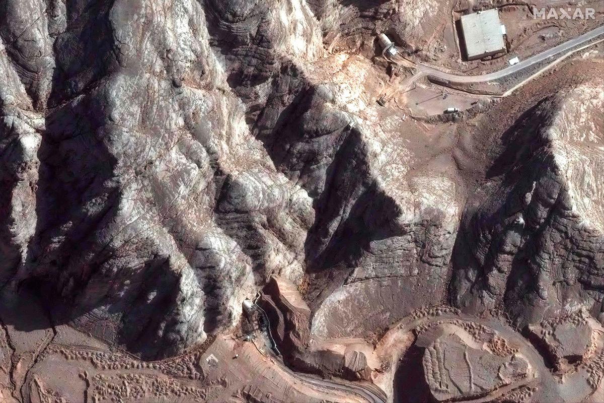 This handout satellite picture shows damage caused by recent airstrikes on nearby tunnel entrances near Isfahan nuclear enrichment facility in central Iran. With his surprise announcement of a ceasefire between Israel and Iran, US President Donald Trump has turned his flair for social media into diplomatic deftness, despite continued uncertainty in the Middle East. - AFP PHOTO/ SATELLITE IMAGE ©2025 MAXAR TECHNOLOGIES