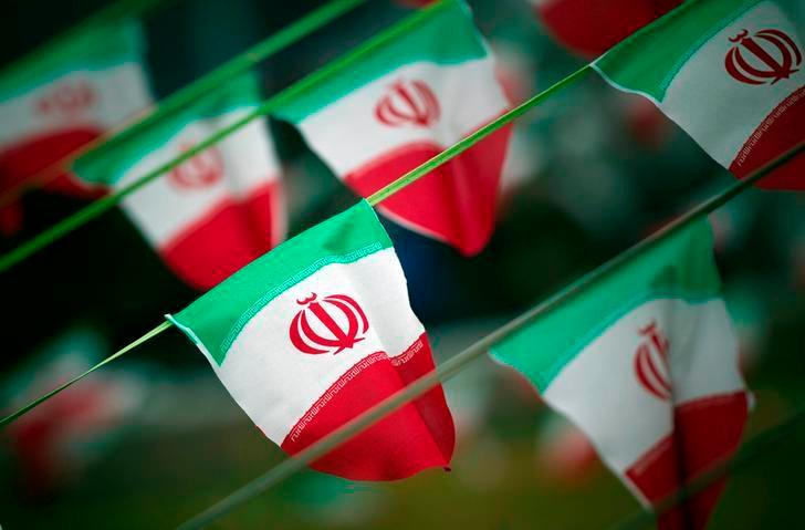 Iran’s national flags are seen on a square in Tehran February 10, 2012. — Reuters