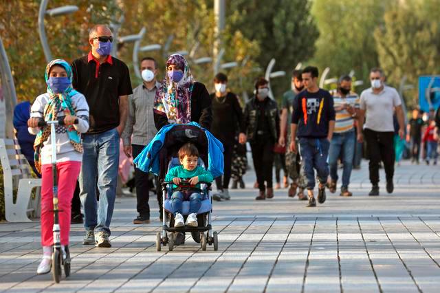 Iranian people wear masks, amid a rise in the coronavirus disease (Covid-19) infections, West Tehran, Iran October 23, 2020. — Reuters