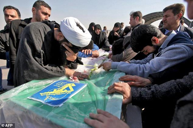 Iranians mourn victims of a suicide bombing on a Revolutionary Guards bus in southeastern Iran, as the coffins arrive at Badr airport in Isfahan, some 400 kilometres south of the capital Tehran on Feb 14, 2019. — AFP