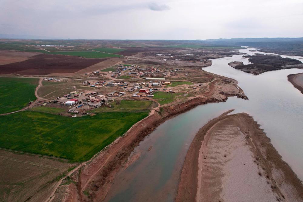 This aerial picture shows a view of the Tigris river, in the village of Bajid Kandala, some 50km west of the northern Iraqi city of Dohuk, on February 18, 2022. - AFPPIX