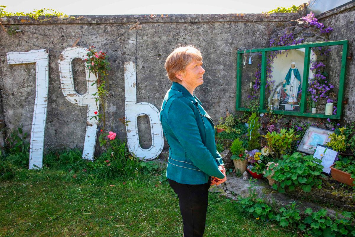 Historian Catherine Corless poses on the site of the former St Mary’s Mother and Baby Home, in Tuam, in the outskirts of Galway, western Ireland, a site believed to be containing a mass grave of children and mothers, on May 20, 2025.