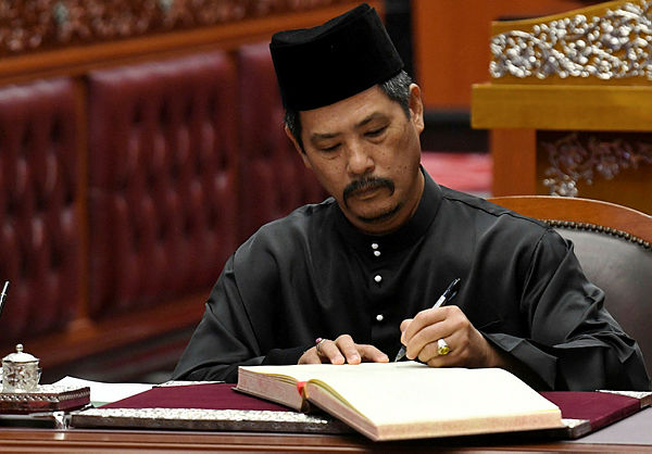 Datuk Isa Ab Hamid is sworn in as a member of the Orang Asli community in the Senate for a second term, in Parliament on April 22, 2019. — Bernama