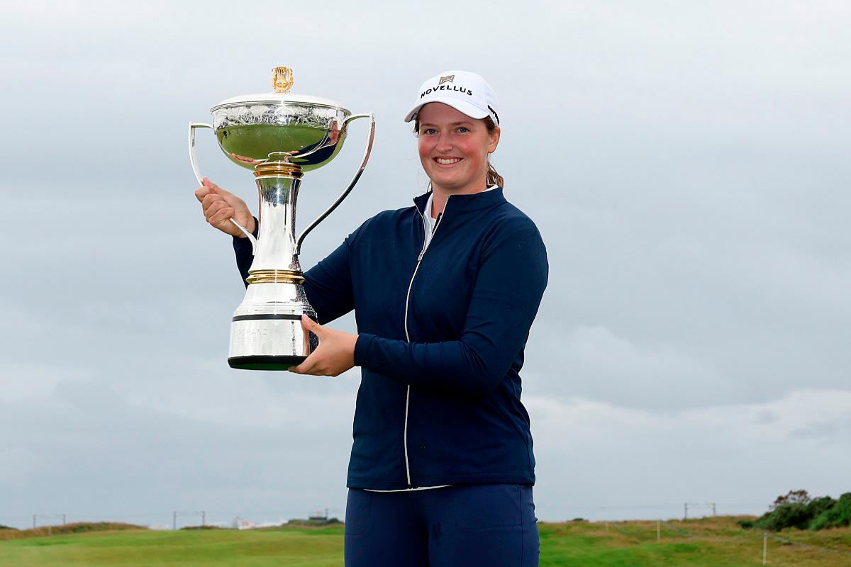 Lottie Woad of England poses with the trophy following victory of the ISPS HANDA Women's Scottish Open. – Kate McShane/Getty Images