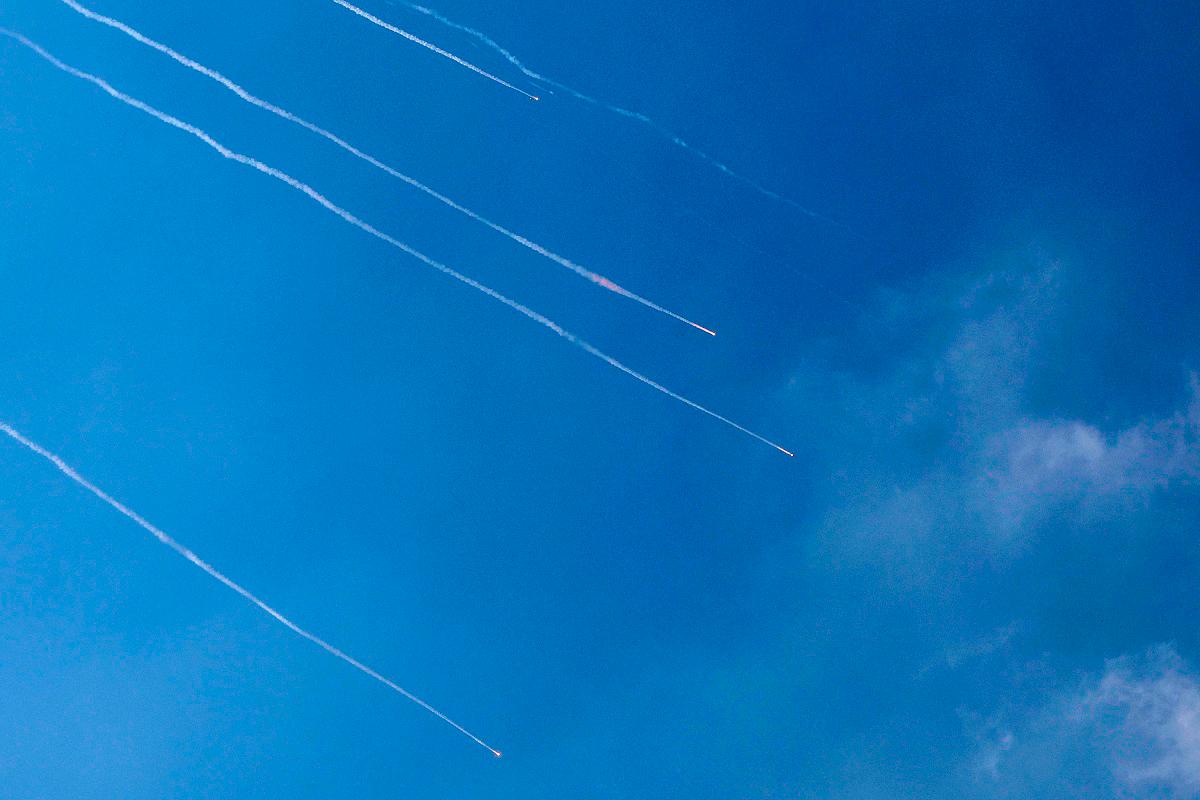 Rocket trails are seen in the sky above the Israeli coastal city of Netanya amid a fresh barrage of Iranian missiles on June 17, 2025. Israel’s military said air raid sirens sounded in several areas of the country on June 17 after identifying missiles launched from Iran, as AFP journalists reported booms over Tel Aviv and Jerusalem. - JACK GUEZ / AFP