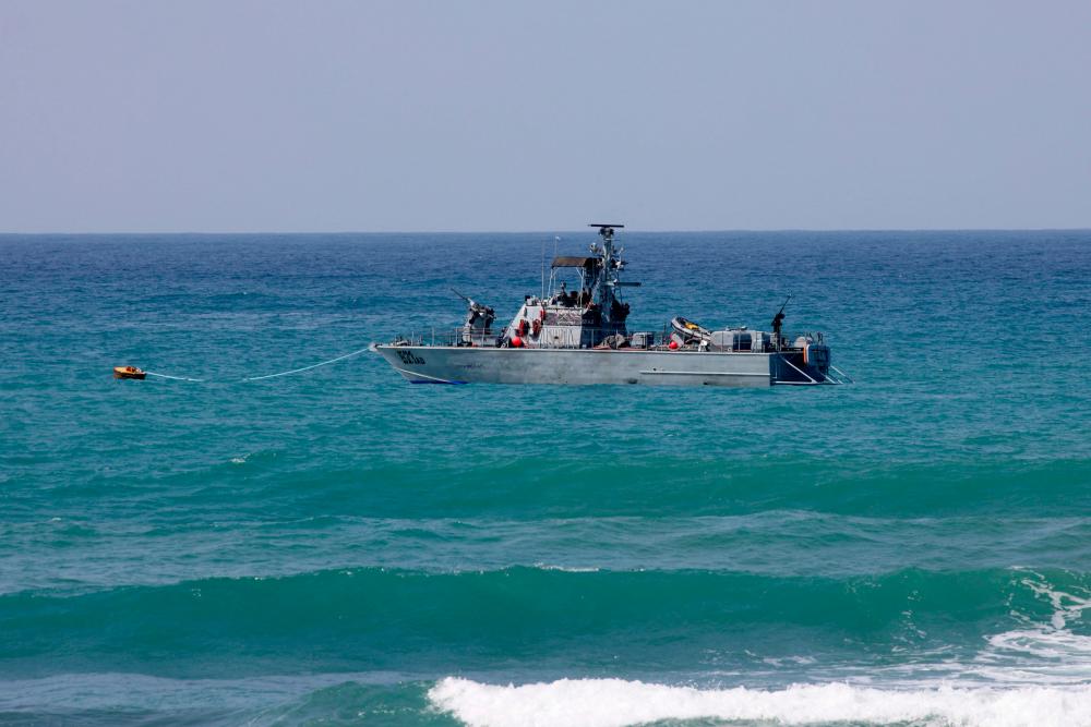 An Israeli navy vessel patrols Mediterranean waters off the coast of Rosh Hanikra, known in Lebanon as Ras al-Naqura, an area at the border between the two coutries, on October 4, 2022. AFPPIX