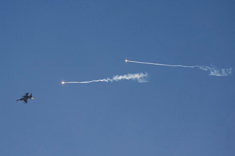 This picture taken from a position in northern Israel shows an Israeli Air Force fighter jet firing flares as it flies to intercept a hostile craft that launched from Lebanon over the border area with south Lebanon on July 7, 2024, amid ongoing cross-border clashes between Israeli troops and Hezbollah fighters. - AFPpix