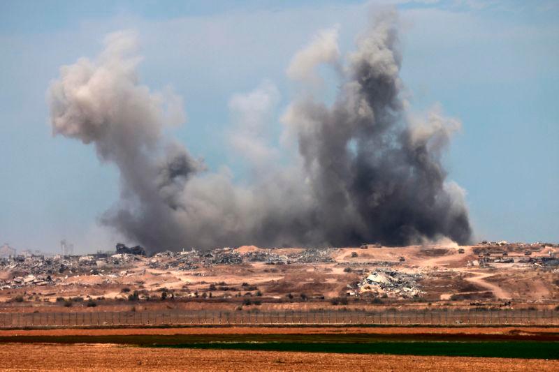 This picture taken from the Israeli side of the border with the Gaza Strip shows smoke plumes rising following explosions inside the Palestinian territory on April 27, 2025. AFPpix