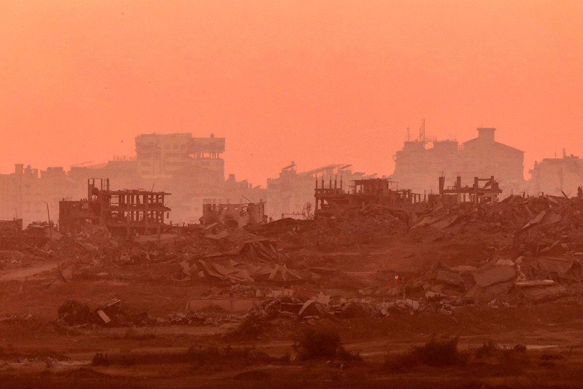 This picture, taken from a position on the Israeli border with the Gaza Strip, shows destroyed buildings in the besieged Palestinian territory - AFPPIX