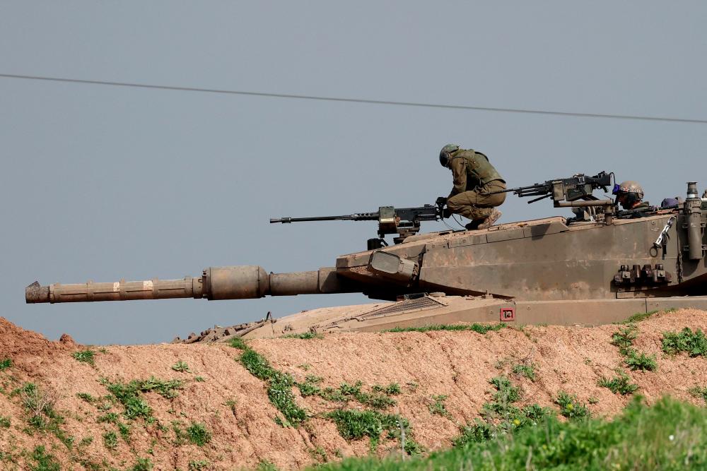 A picture taken from a position in southern Israel along the border with the Gaza Strip on February 9, 2024, shows an Israeli tank amid continuing battles between Israel and the Palestinian militant group Hamas. - AFPPIX