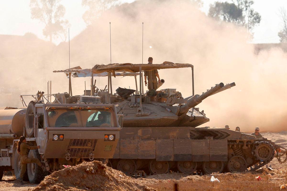 This picture taken from a position at Israel’s border with the Gaza Strip on July 23, 2025 shows Israeli troops deploy at the border with the besieged Palestinian territory. - AFP