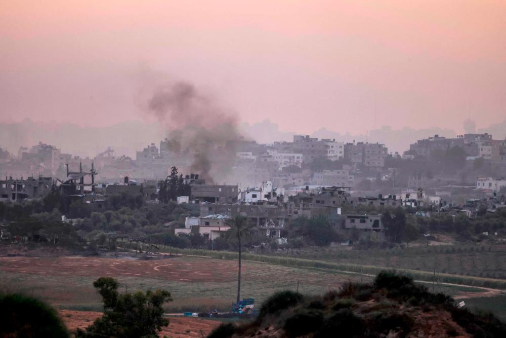 A picture taken from southern Israel along the border with the Gaza Strip shows smoke billowing in Gaza, on October 29, 2023 amid ongoing battles between Israel and the Palestinian militant group Hamas.//AFPPIX
