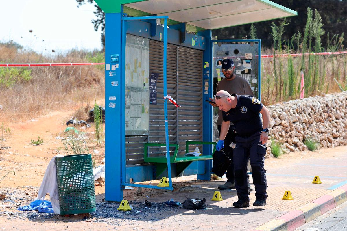 Israeli police conduct a search at the site of a reported ramming attack in the central Israeli city of Kfar Yona on July 24, 2025. (Photo by Jack GUEZ / AFP)