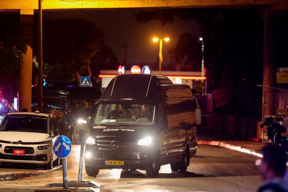 A convoy carrying Israeli hostages released by Hamas from the Gaza Strip arrives at the Sheba Medical Center in Ramat Gan, on November 26, 2023. - AFPPIX