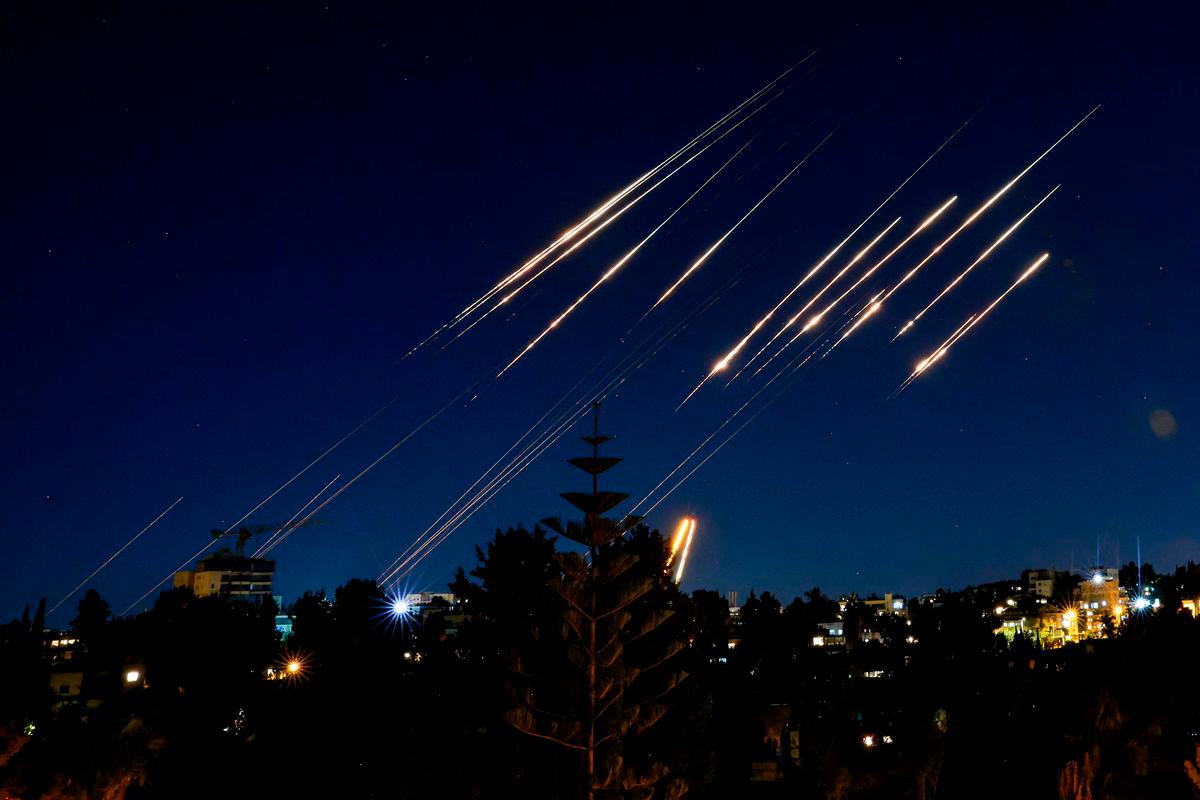 Missiles fired from Iran are pictured in the night sky over Jerusalem on June 14, 2025. Israel and Iran exchanged fire on June 14, a day after Israel unleashed an unprecedented aerial bombing campaign that Iran said hit its nuclear facilities, “martyred” top commanders and killed dozens of civilians. AFP