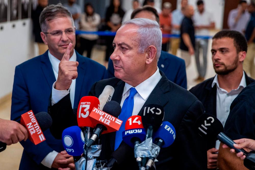 Israel’s former premier Benjamin Netanyahu speaks to the press at the Knesset (parliament) in Jerusalem on June 20, 2022. AFPPIX