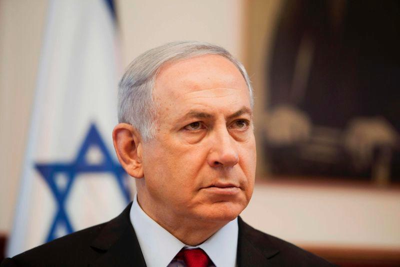 Israeli Prime Minister Benjamin Netanyahu looks on as he chairs the weekly cabinet meeting in his Jerusalem office on June 26, 2016. - AFPPIX