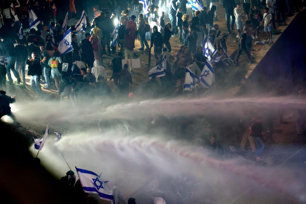 Protesters clash with the police during a rally against the Israeli government's judicial reform in Tel Aviv, Israel on March 27, 2023. AFPPIX