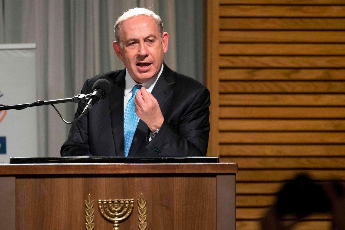 Israeli Prime Minister Benjamin Netanyahu delivers a speech before lighting the candles during the start of the Jewish light festival of Hanukkah in Rhavat Ronit, south of Netanya on December 24, 2016. AFPPix