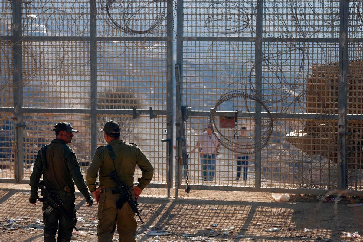 Pix for visual purposes - Israeli troops stand guard as members of Syria’s Druze community cross walk towards the fence to cross into the Israeli-annexed Golan Heights - AFPPix