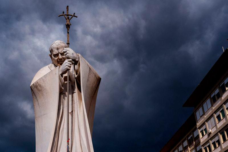 Dark clouds are seen above the statue of John Paul II outside the Gemelli hospital where Pope Francis is hospitalized with pneumonia, in Rome - AFPpix