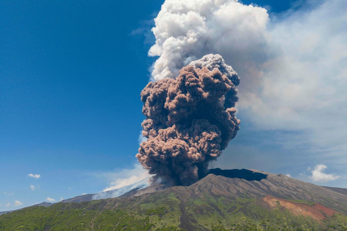 Smoke rises from the crater of the Etna volcano as it erupts, on Mount Etna near Catania on June 2, 2025. A huge plume of ash, gas and rock spewed forth on June 2, 2025, from Italy’s Mount Etna, Europe’s largest active volcano, after a portion of its southeastern crater likely collapsed, authorities said. - Giuseppe Distefano / AFP