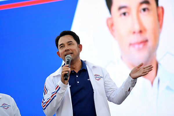 Itthipol Khunpleum, candidate for the Phalang Pracharat party, speaks during a campaign rally in Chonburi province — AFP