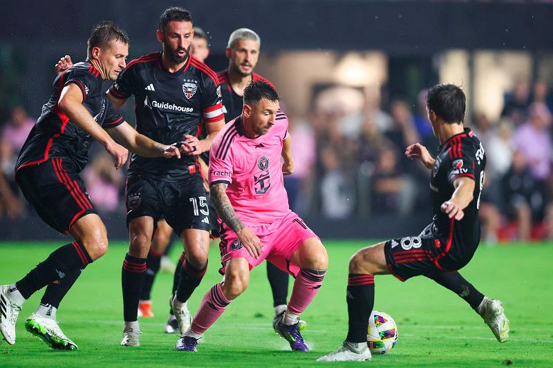 Lionel Messi #10 of Inter Miami competes for the ball against Jared Stroud #8 of D.C. United during the first half of the game at Chase Stadium on May 18, 2024 in Fort Lauderdale, Florida. - Megan Briggs/Getty Images/AFP