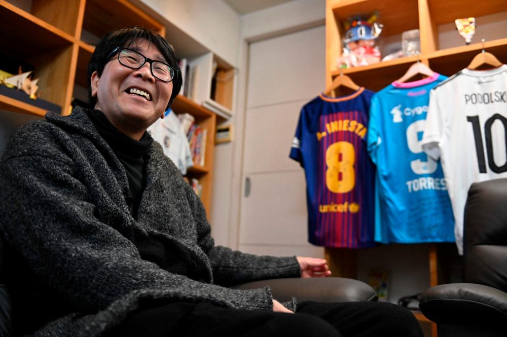 This photo taken on January 30, 2023 shows Japanese cartoonist and manga artist Yoichi Takahashi, best known for his work “Captain Tsubasa”, speaking during an interview with AFP at his workplace in Tokyo. AFPPIX