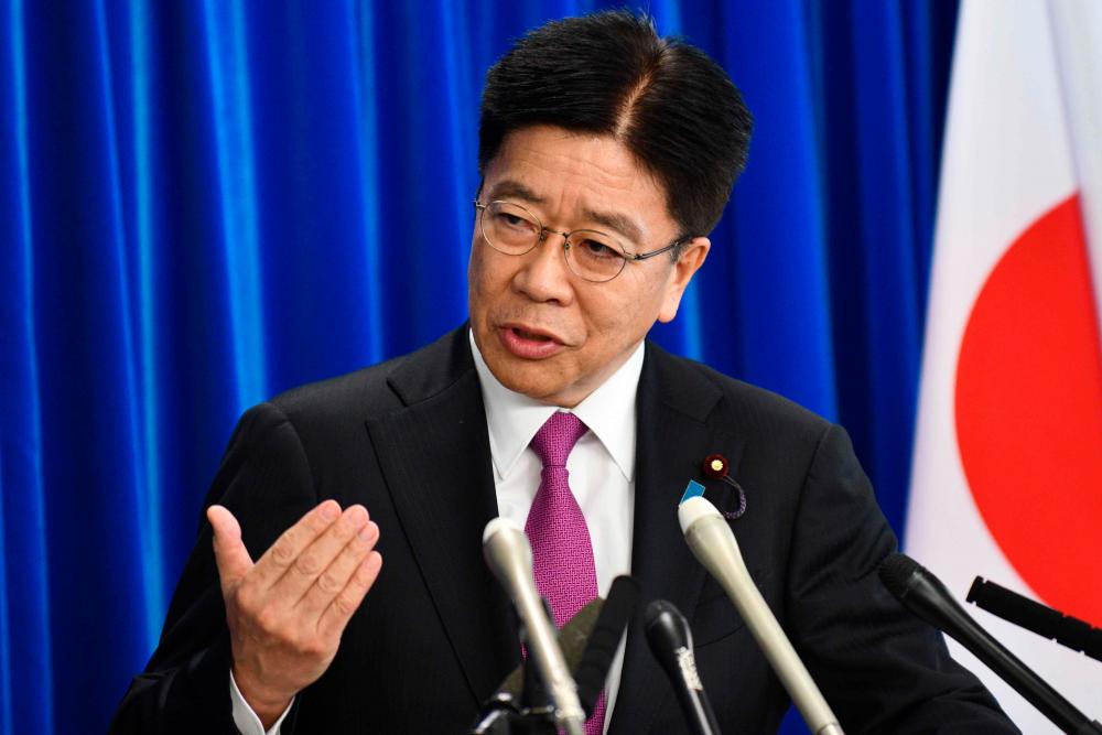 Japan’s health minister Katsunobu Kato delivers a speech during a press conference at the ministry in Tokyo on February 21, 2020. - AFP